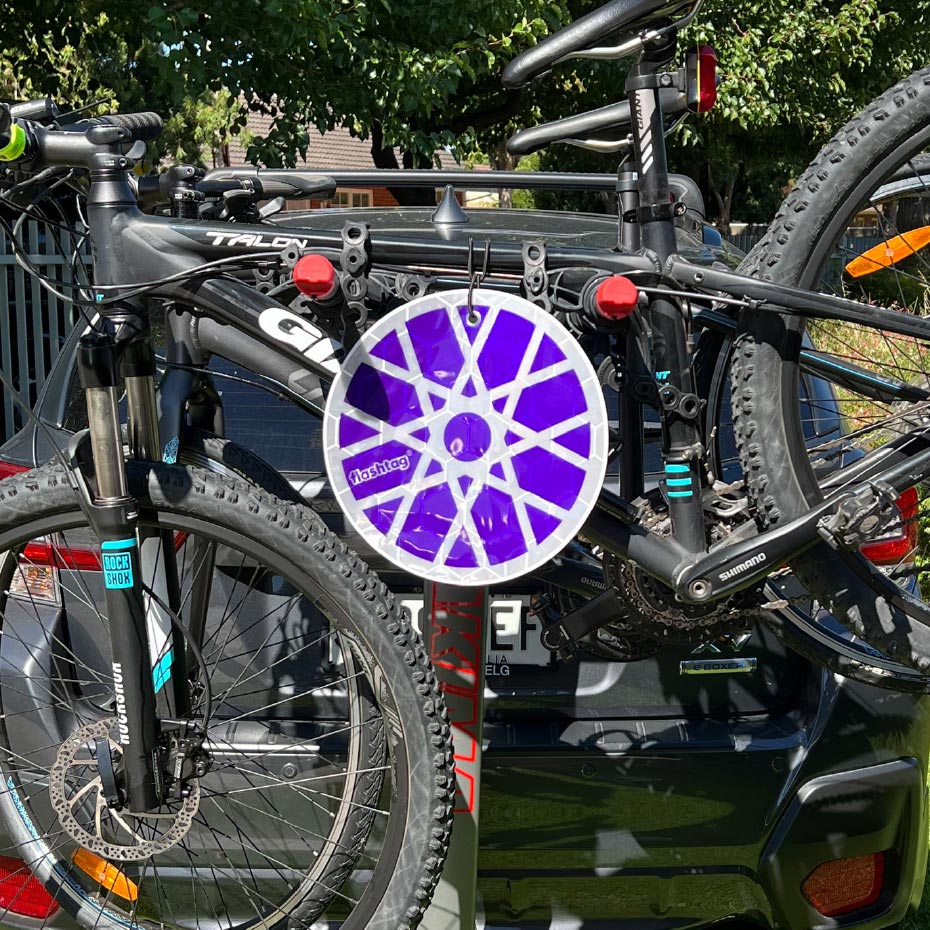 Flashtag Bike Wheel reflector on mountain bikes attached to a car